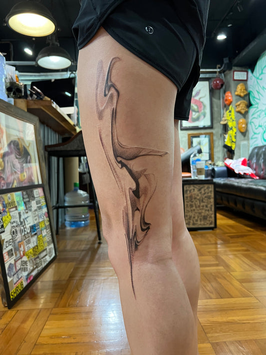 Organic abstract blackwork tattoo flowing naturally on the leg by Melbourne tattoo artist Mr Inking Tattoo